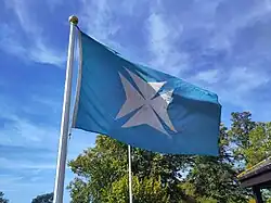 The flag of WCBC flying at their boathouse.
