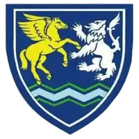 Wallace Hall (Thornhill) crest showing a yellow Pegasus and a white heraldic lion on a dark blue shield, with green and light blue wavy lines at the bottom.