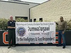 Washoe Tribal chairman Serrell Smokey (right) thanks firefighters and first responders on behalf of the Washoe Tribe of Nevada and California on July 26.