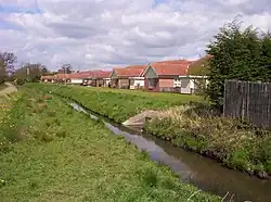 Westfield Beck behind housing on the west of New Earswick
