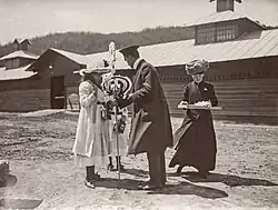 Anastasia Nikolaevna (partially hidden) and her sister Maria Nikolaevna selling flowers in Yalta, May 3, 1912.