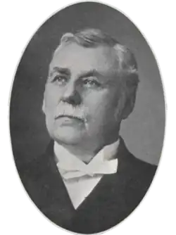 the article subject dressed in a jacket and necktie