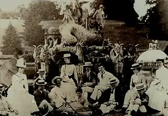 Garden Party in front of the Perseus and Andromeda fountain circa 1900. The Countess of Dudley is seated in the center; her daughter, Edith, is in the boat; her daughter, Lady Mackenzie is 2nd from right; Thomas Thynne, 5th Marquess of Bath is 5th from right, and next to him Violet Mordaunt (daughter of Harriet Mordaunt and later Marchioness of Bath).
