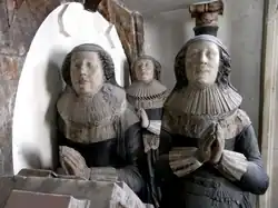 Chichester's two wives, and behind them his daughter Anne. Detail from his monument.