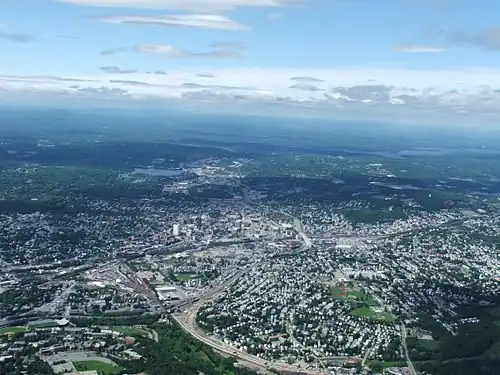 Worcester and the surrounding areas in 2006, looking north from 3,700 feet (1,100&nbsp;m). Route 146 can be seen under construction.