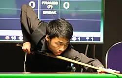 picture of Xu Si at a snooker table