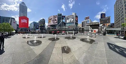 A 180-degree panoramic view taken from the centre of the square.