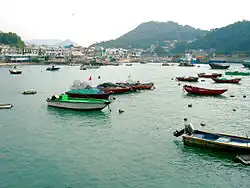 Yung Shue Wan bay boats resting in the low tide.