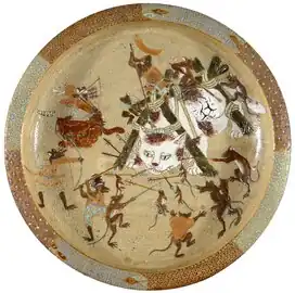 Japanese Mino ware (stoneware) plate decorated with an image of rats attacking cats after Kawanabe Kyousai (1831-1899). Found at the Russell-Cotes Art Gallery & Museum in Bournemouth, England.